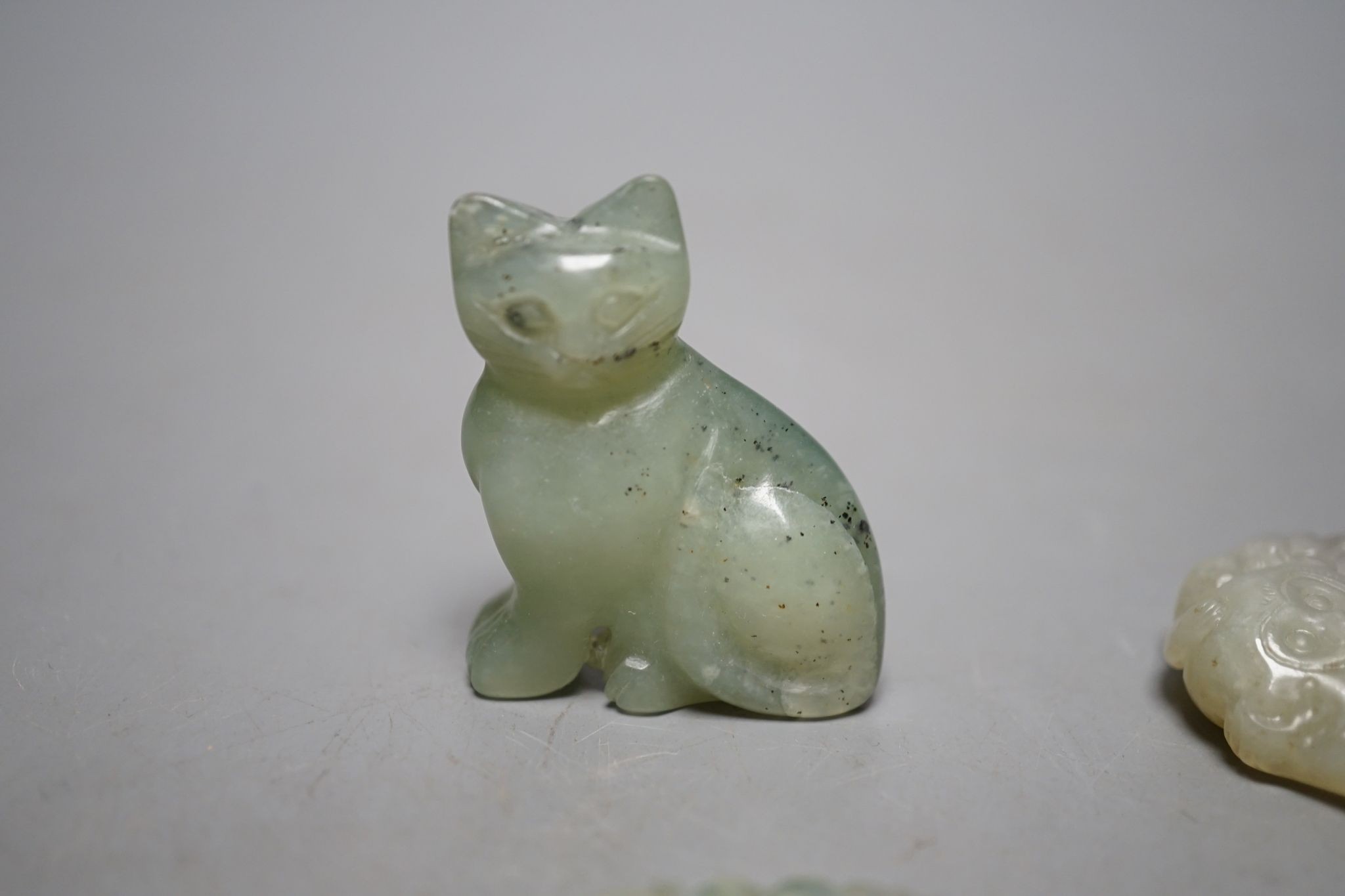 Four Chinese jade carvings of animals and fruit, tallest 4cm